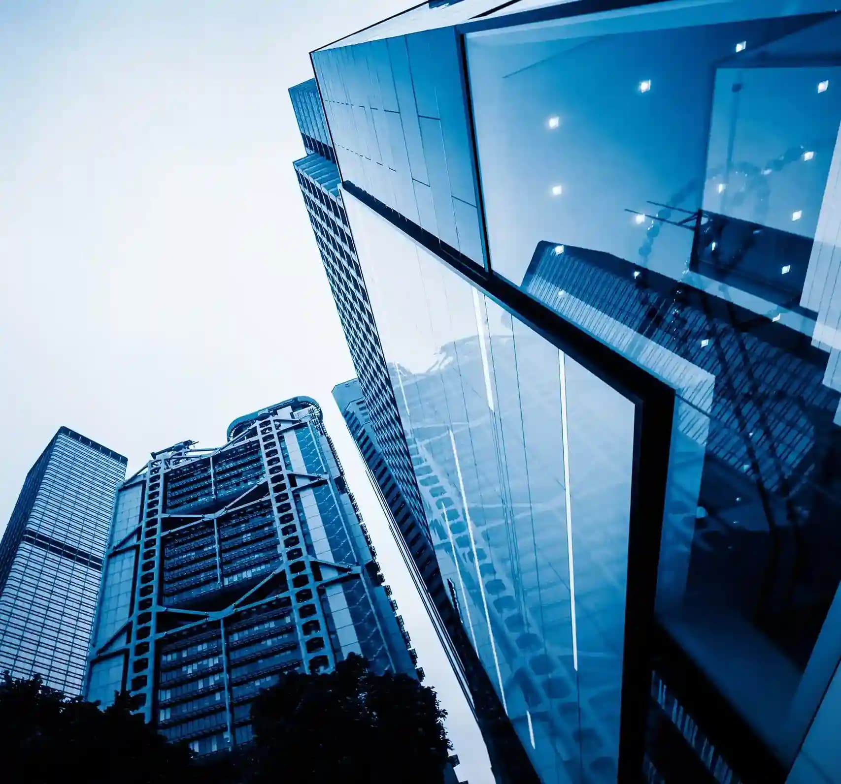 Modern enterprise corporate building with glass facade and high-rise architecture representing large-scale business operations.