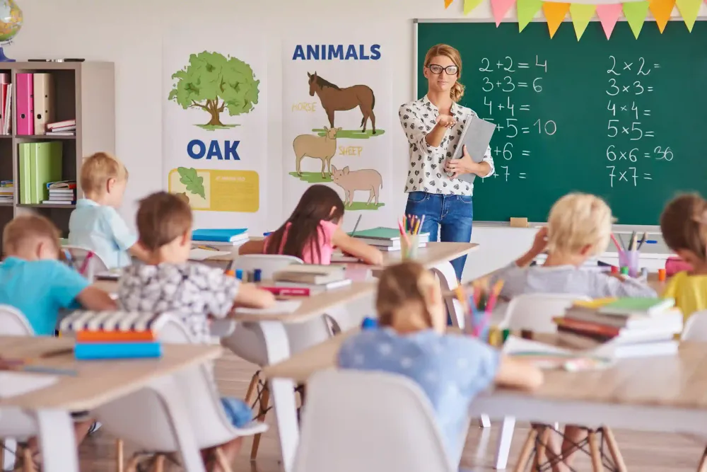 Education industry classroom with teacher and students learning, representing ai for development solutions for schools.